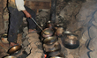 A Kashmiri waza (expert cook) prepares a wazwan (banquet) of 54 meat dishes on log fires i...