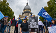 An anti-COVID tyranny protest is seen outside the Illinois State Capitol on October 2, 202...