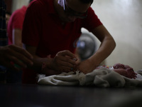 A nurse gives an Hepatitis A vaccines, to a child in the vaccine's center belongs to the Syrian Arab Red Crescent - Douma branch,
Picture i...