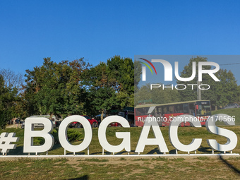 Huge hashtag Bogacs inscription in front of small wine cellars at the hill on the outskirts of the village is seen in Bogacs, Hungary on 25...