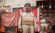 A traditionally dressed Kurd stands on the bazar in Dohuk / Summer 2013.  