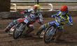 Jack Holder  (Red) forces his way past Richie Worrall  (Yellow) during the SGB Premiershi...