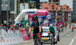 Participants pass through the finish line during the last stage finals of the Vuelta a Col...