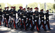 Members of the Royal Regiment of Canadian Artillery march from Buckingham Palace to Wellin...