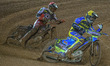 Troy Batchelor  (Yellow) pulls off a tear off from his goggles ahead of Dan Bewley  (Red)...