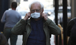 A man wearing a face mask is seen on 08 October, 2021 in Warsaw, Poland. Poland has seen a...