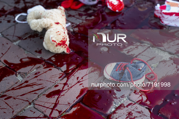 Group of activists spilled blood and dropped baby toys in front of Polish Parliment, in a protest against anti-migration activities ordered...