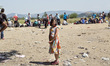 A syrian girl is seen at the border between Greece and Macedonia.