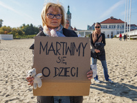 Protester holding 'we care about children' banner are seen in Sopot, Poland on 10 October 2021  People protest under the slogan: Don't take...