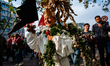 A woman is wearing plants representing mother nature, during the demonstration Back to Cli...