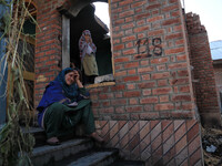 A Kashmiri woman breaks down outside her house which was damaged by Indian forces during an encounter with Kashmiri militants in Tulran vill...