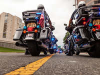 Dozens of motorcycle officers escort families of police who have been killed in the line of duty to Police Weekend.  The annual event is hel...
