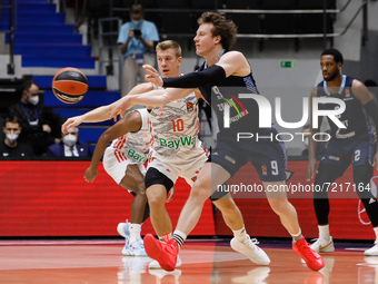 Dmitry Kulagin #9 of Zenit and Ognjen Jaramaz #10 of Bayern in action during the EuroLeague Basketball match between Zenit St. Petersburg an...