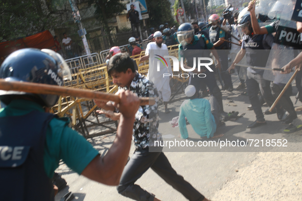 Police clash with Muslim devotees during a protest over demeaning of the Holy Quran in Cumilla, in Dhaka, Bangladesh on October 15, 2021. 