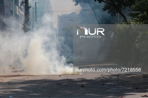 Protestor throw stones towards police during a protest over demeaning of the Holy Quran in Cumilla, in Dhaka, Bangladesh on October 15, 2021...