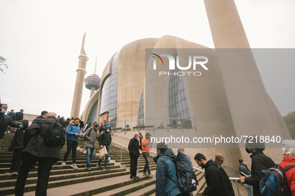 people are seen entering the mosque during the protest over city decision allowing broadcasting the call for prayer at Cologne central mosqu...