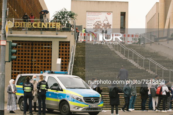 polices are seen during the protest over city decision allowing broadcasting the call for prayer at Cologne central mosque in Cologne, Germa...