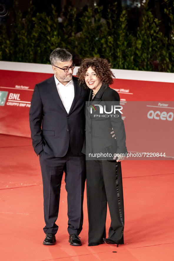 Director Giuseppe Bonito and a guest attend the red carpet of the movie "L'Arminuta" during the 16th Rome Film Fest 2021 on October 15, 2021...