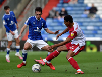 Oldham Athletic's Callum Whelan tussles with Luther Wildin of Stevenage Football Club during the Sky Bet League 2 match between Oldham Athle...
