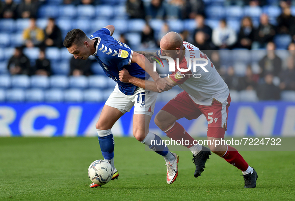 Oldham Athletic's Zak Dearnley tussles with Scott Cuthbert of Stevenage Football Club during the Sky Bet League 2 match between Oldham Athle...