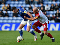 Oldham Athletic's Zak Dearnley tussles with Scott Cuthbert of Stevenage Football Club during the Sky Bet League 2 match between Oldham Athle...