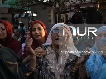 Kashmiri women wail near the gun battle site in Pampore area of Pulwama district south of Srinagar, Indian Administered Kashmir on 16 Octobe...