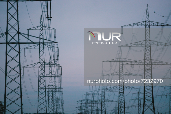 Electricity transmission pylons are seen in Wesseling, Germany on Oct 17, 2021 