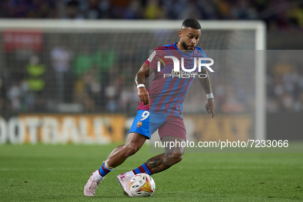 Memphis Depay of Barcelona in action during the La Liga Santander match between FC Barcelona and Valencia CF at Camp Nou on October 17, 2021...