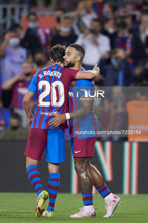 Memphis Depay of Barcelona celebrates after scoring his sides first goal during the La Liga Santander match between FC Barcelona and Valenci...