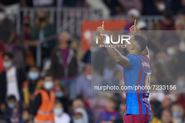 Memphis Depay of Barcelona celebrates after scoring his sides first goal during the La Liga Santander match between FC Barcelona and Valenci...
