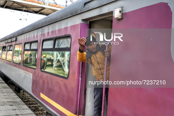 An Indian migrant worker calls other workers who failed to board the train to their home states following attacks on migrant labourers by un...