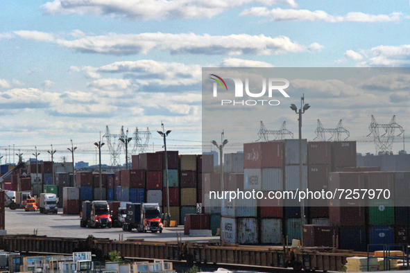 Trucks unload containers at an intermodal cargo facility in Mississauga, Ontario, Canada, on July 30, 2021.  