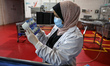 Palestinian workers work at the Hanover factory for the milk and dairy industries and its...