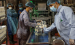 Palestinian workers work at the Hanover factory for the milk and dairy industries and its...