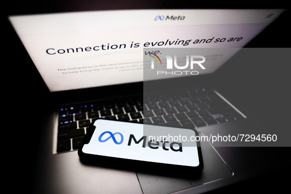 Meta website displayed on a laptop screen and Meta logo displayed on a phone screen are seen in this illustration photo taken in Krakow, Pol...