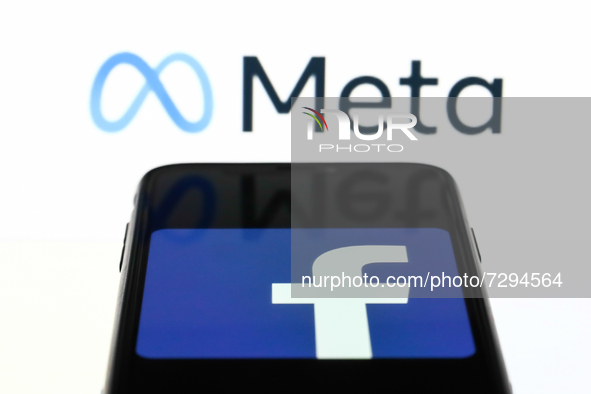 Meta logo displayed on a laptop screen and Facebook app logo displayed on a phone screen are seen in this illustration photo taken in Krakow...