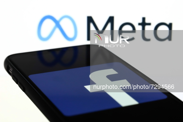 Meta logo displayed on a laptop screen and Facebook app logo displayed on a phone screen are seen in this illustration photo taken in Krakow...