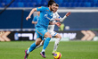 Sardar Azmoun (L) of Zenit St. Petersburg and Sebastian Szymanski of Dynamo Moscow vie for...
