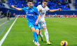 Vyacheslav Karavaev (L) of Zenit St. Petersburg and Arsen Zakharyan of Dynamo Moscow vie f...