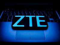 ZTE logo displayed on a phone screen and a laptop keyboard are seen in this illustration photo taken in Krakow, Poland on October 30, 2021....