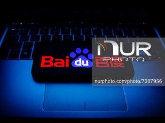 Baidu logo displayed on a phone screen and a laptop keyboard are seen in this illustration photo taken in Krakow, Poland on October 30, 2021...