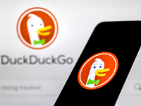 DuckDuckGo logo displayed on a phone screen and DuckDuckGo website displayed on a laptop screen are seen in this illustration photo taken in...