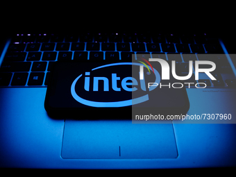Intel logo displayed on a phone screen and a laptop keyboard are seen in this illustration photo taken in Krakow, Poland on October 30, 2021...