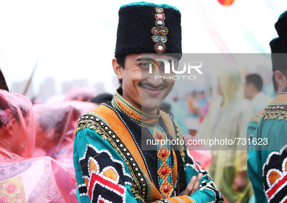 ORDOS, Aug 13, 2015 () -- An actor waits to perform during a performance gala by all the ethnic groups at the 10th National Traditional Game...