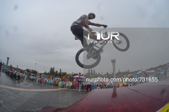 ORDOS, Aug 13, 2015 () -- An athlete performs BMX halfpipe during a performance gala by all the ethnic groups at the 10th National Tradition...