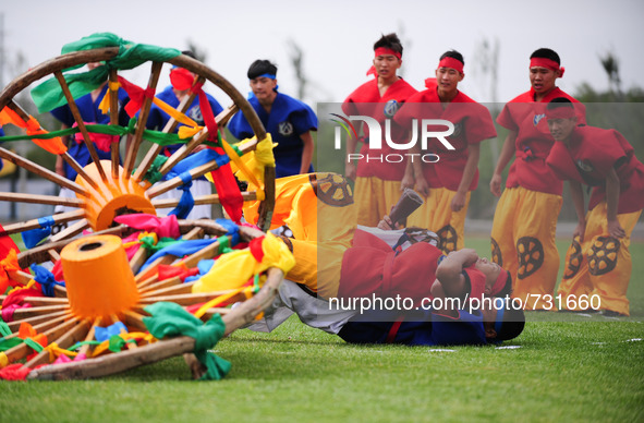 ORDOS, Aug 13, 2015 () -- Athletes from north China's Inner Mongolia Autonomous Region perform during the 10th National Traditional Games of...