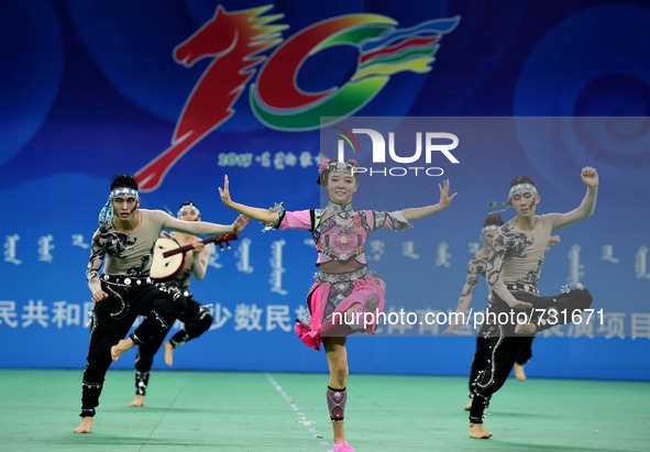 ORDOS, Aug 13, 2015 () -- Dancers from east China's Shanghai Municipality perform during the 10th National Traditional Games of Ethnic Minor...