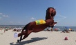 People flies kites in the Black sea town of Varna, Bulgaria, Saturday, Aug. 15, 2015 durin...