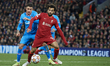 Mohamed Salah of Liverpool and Jose Maria Gimenez of Atletico Madrid compete for the ball...