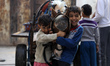 Palestinian children play with a horse in the street of al Shateaa refugee camp in Gaza Ci...